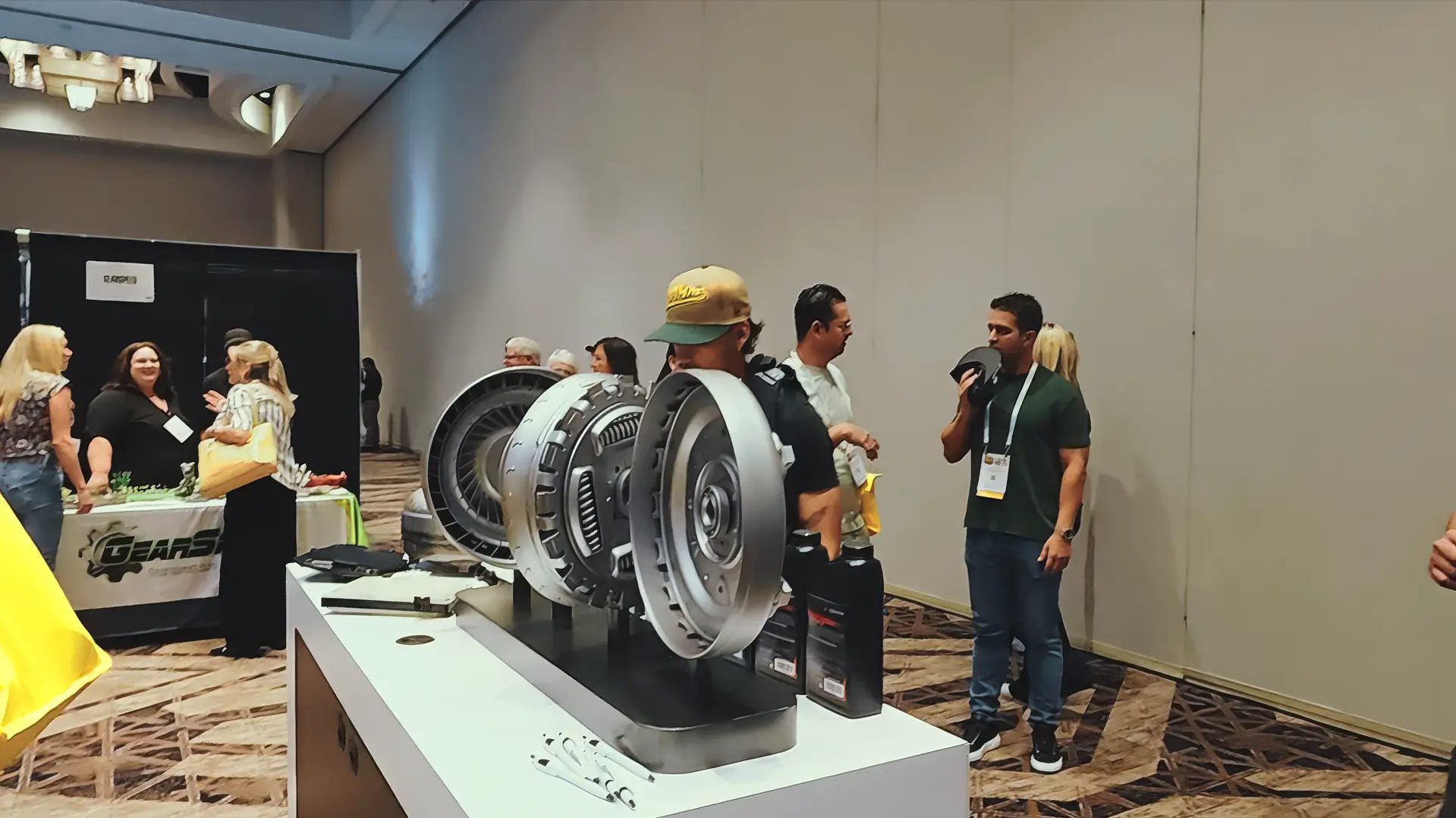 Exhibitor booths and attendees on a previous Powertrain Expo trade show floor
